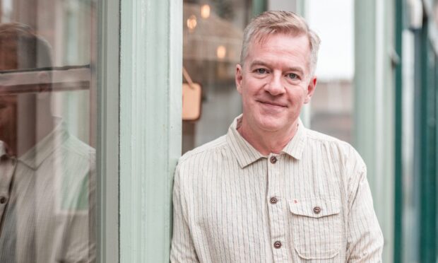 Charlie Connelly stands outside Dundee favourite eating place Pacamara.