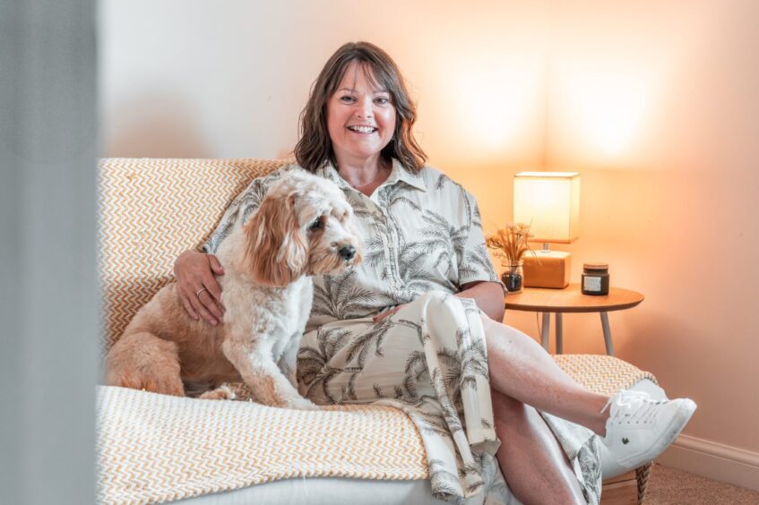 Helen at home with Cavapoo Ozzy.