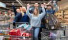 Chanice MacPherson with her trolleys of shopping after doing a five-minute supermarket sweep at Aldi Broughty Ferry.