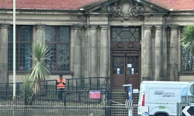 A security guard outside Coldside Library.