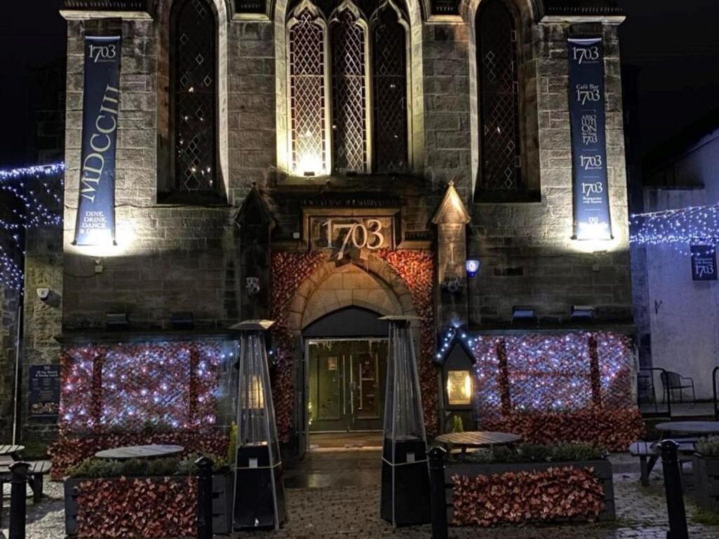 An external view of the church building at night. 