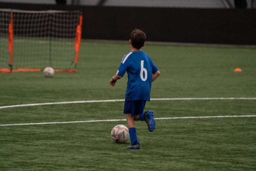 Boy playing football