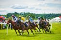 jockeys on horses compete when you purchase Perth Racecourse tickets