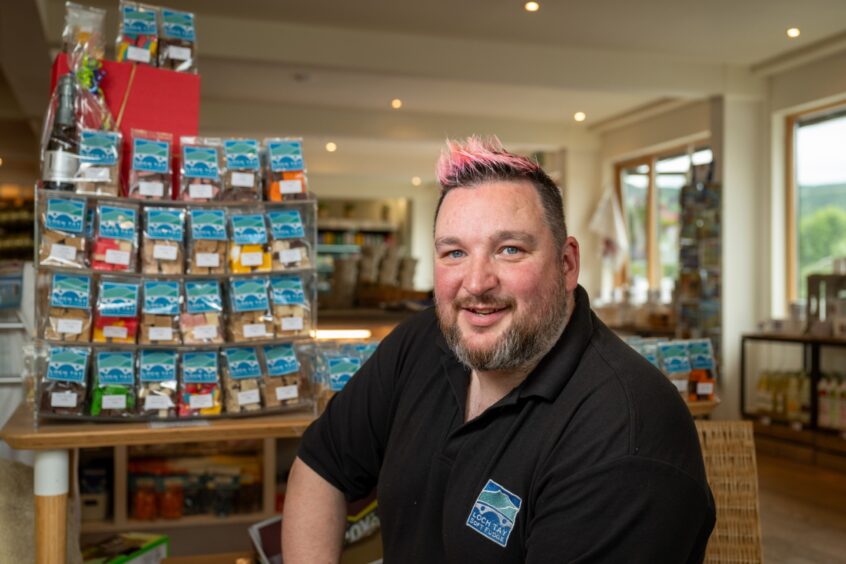 Mike Davies beside display of fudge