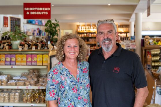 Henry and Marion Murdoch inside the shop
