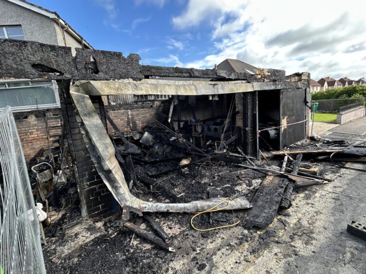 Little remains of the garages destroyed in the fire.