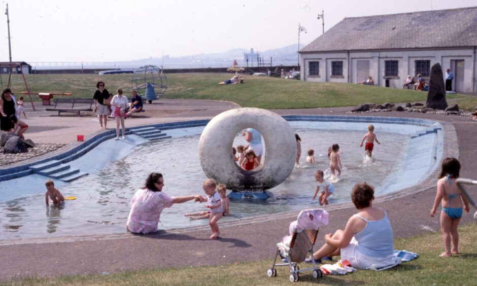 People enjoying a cooling dip in the sunshine at the paddling pool in 1989. Image: DC Thomson,