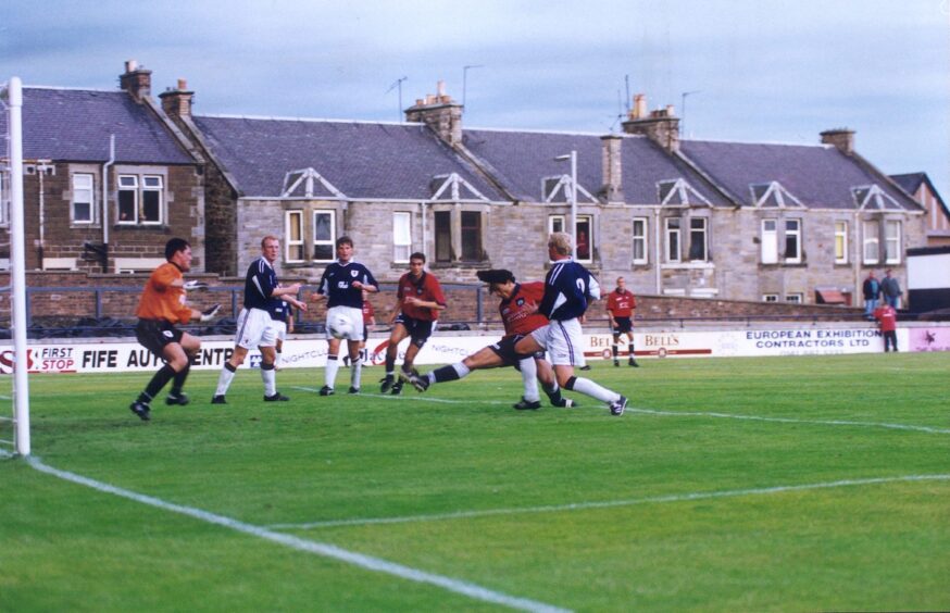 Dundee and Raith Rovers players in the box as Fabian Caballero scores the equaliser in July 2000. 