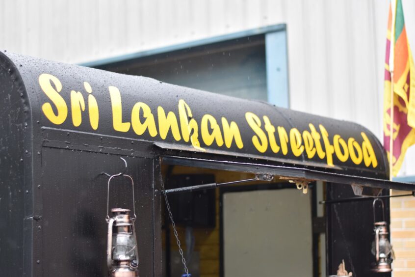 A sign painted on Truck Sri.