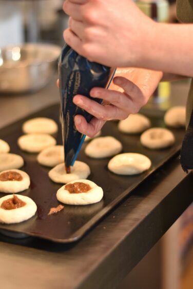 Emily Black making miniature flatbreads.