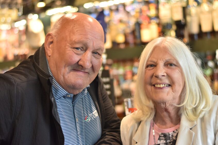 Jimmy Hay (left) and Edith Woolston (right) posing in The Keys Bar.