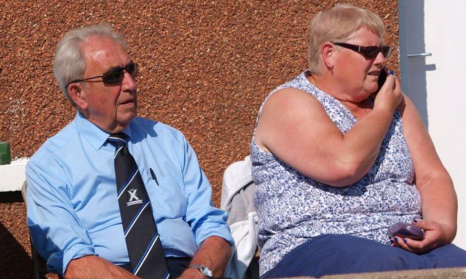 David Lawrie and wife Lindsey watching a game.