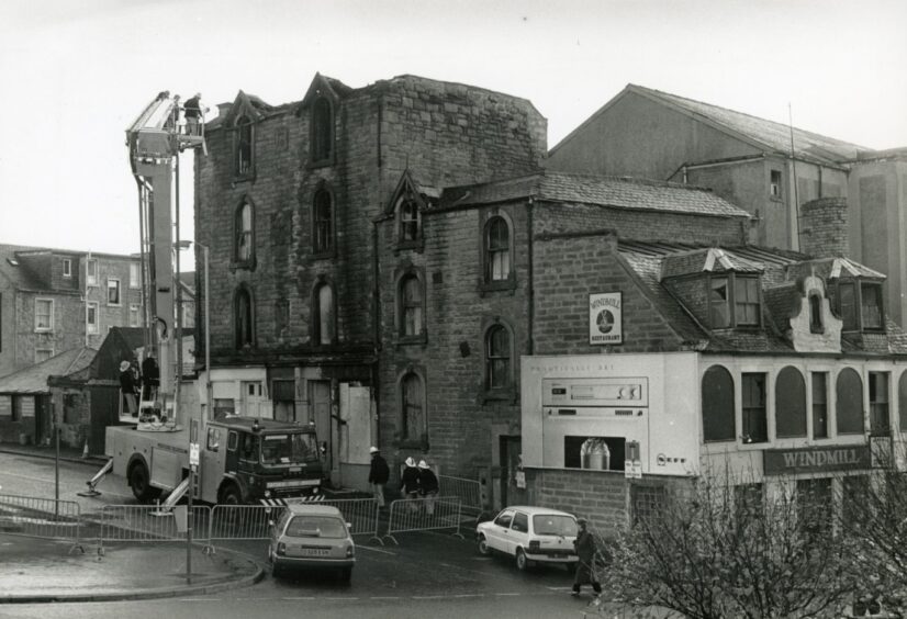 Firefighters at the aftermath of a fire on Ann Street in 1988. 