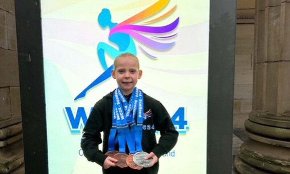Ella Bloice with her medals. 