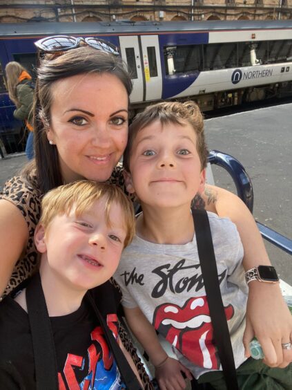 Emma Dechant with her two sons, aged six and eight.