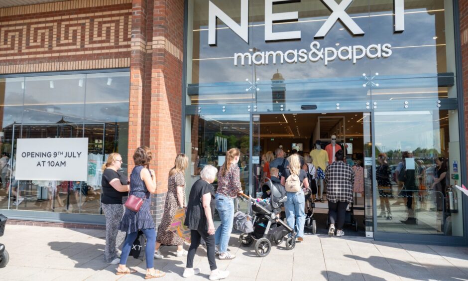Customers enter the Next store for the first time.
