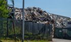 Piled-up waste can be seen at GRC Skip Hire on Dundee's West Gourdie Industrial Estate.