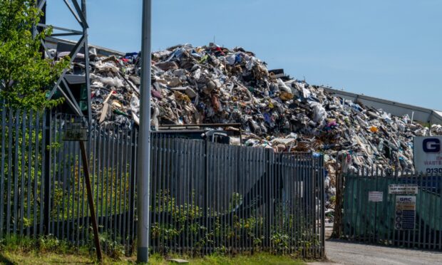 Piled-up waste can be seen at GRC Skip Hire on Dundee's West Gourdie Industrial Estate.