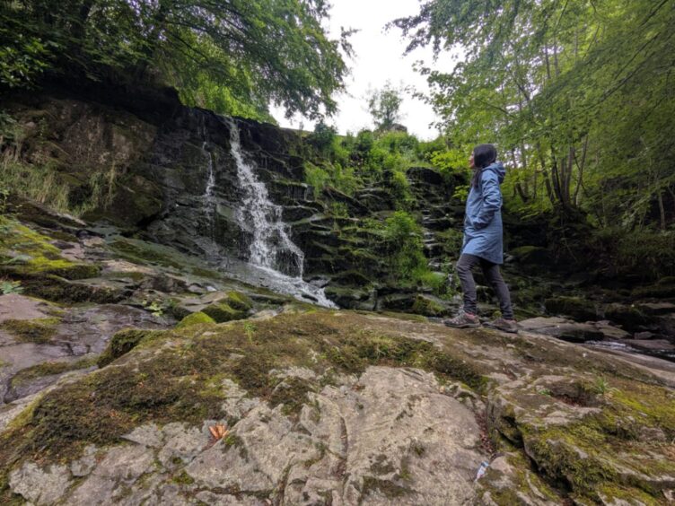 Gayle at the waterfall in the hidden valley near Glamis. 