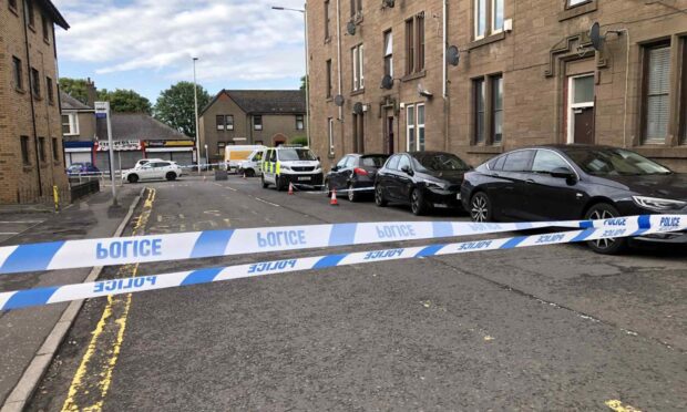 Police tape at an area of Graham Street, Dundee.