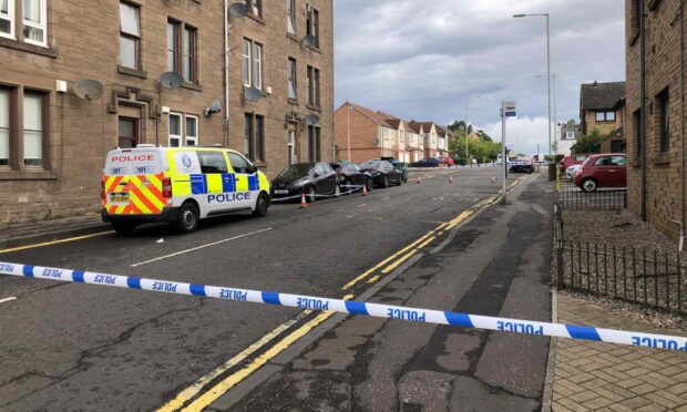 Police taped off an area of Graham Street, Dundee.