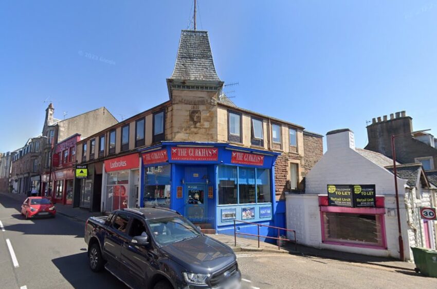 Gurkha's restaurant on corner with Ladbroke's building next door.