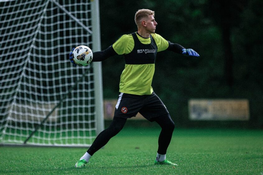 Yevhenii Kucherenko in action for the Tangerines after receiving his clearance