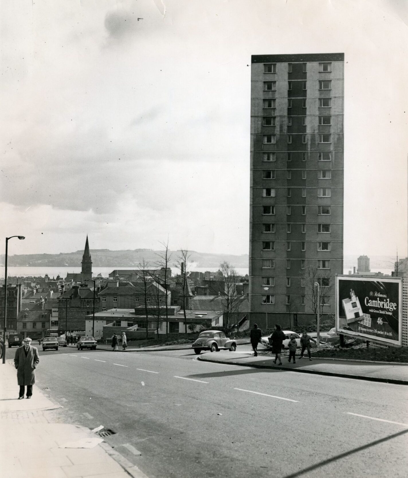 people on the pavements and the River Tay in the background in this shot of the Dallfield multis in April 1970
