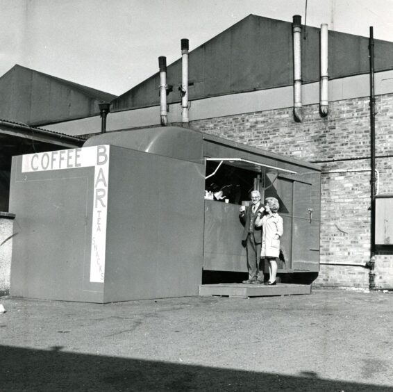 two people at the coffee stall at the top of the Hilltown