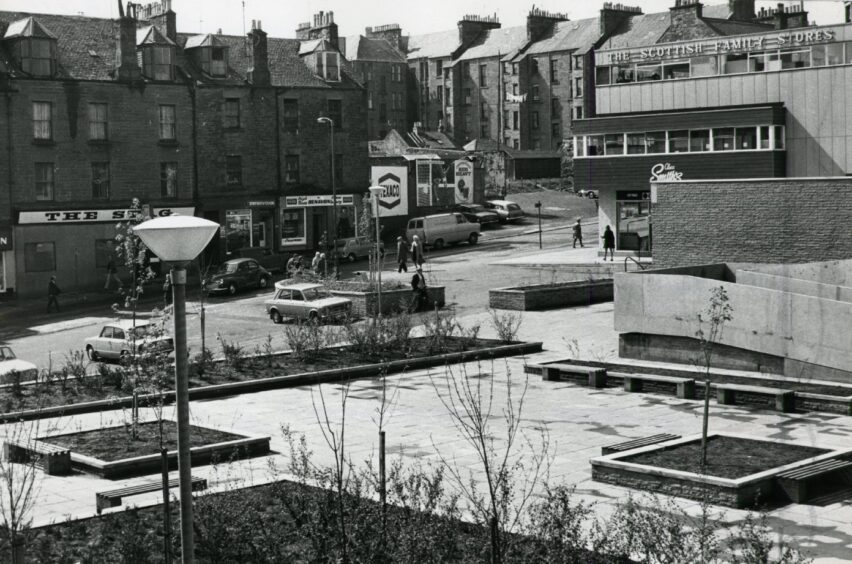 the slabbed area with flower beds called Ann Street Gardens