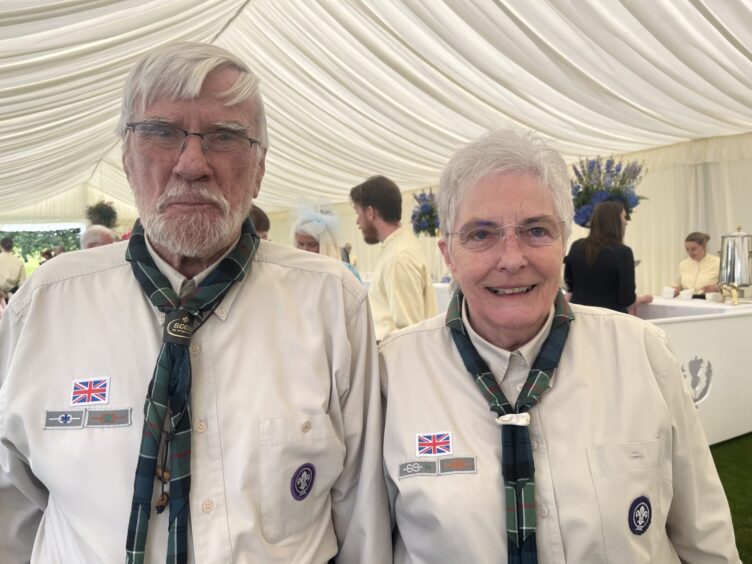Jimmy Comrie BEM and Christine Comrie in scout year in tent at garden party