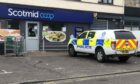Police outside the Scotmid Co-op shop in Invergowrie on Tuesday. Image: James Simpson/DC Thomson