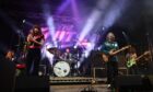 The Zutons performing on stage.