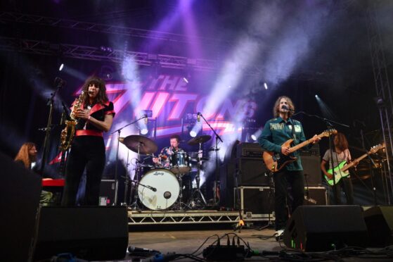 The Zutons performing on stage.