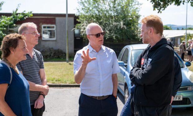 CR0054175, Sean O'Neil, Dundee. Joe Fitzpatrick to meet Raac affected residents at Cart Place in Dundee. Picture Shows: From L-R Dundee  Councillor Heather Anderson, Nigel Kestell (resident), Joe Fitzpatrick SNP MSP for Dundee City West Dundee, and Wayne Hoskins meet at Cart Place . Friday 11th July 2025. Image - Richard Hancox/DC Thomson