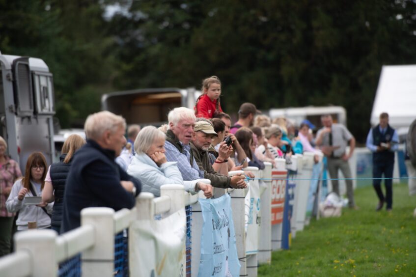 Onlookers enjoy the judging for the cattle best in show during the Braco Show in Perthshire.