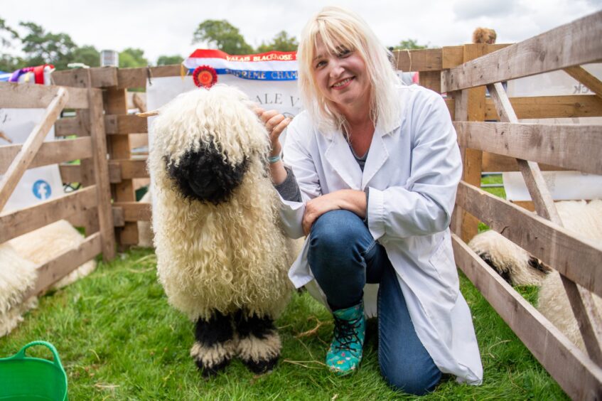 A proud farmer and her prizewinning lamb at the Braco Show.