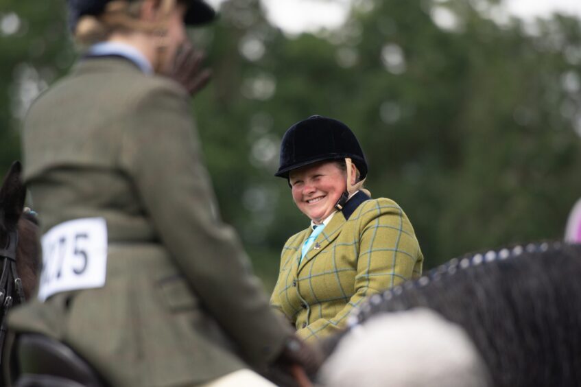 Entrants share a laugh during the Clydesdale competition.