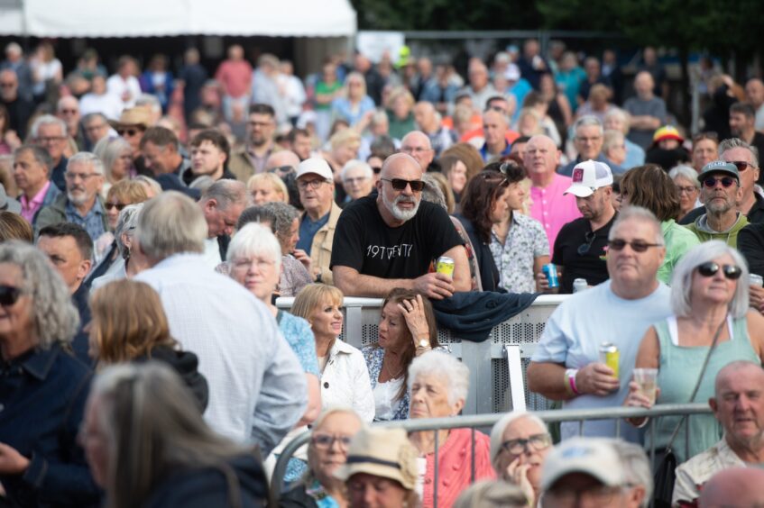 The crowd is abuzz for Tom Jones' headline performance.
