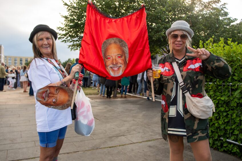 A pair of big Tom Jones fans show their banner in Dundee.