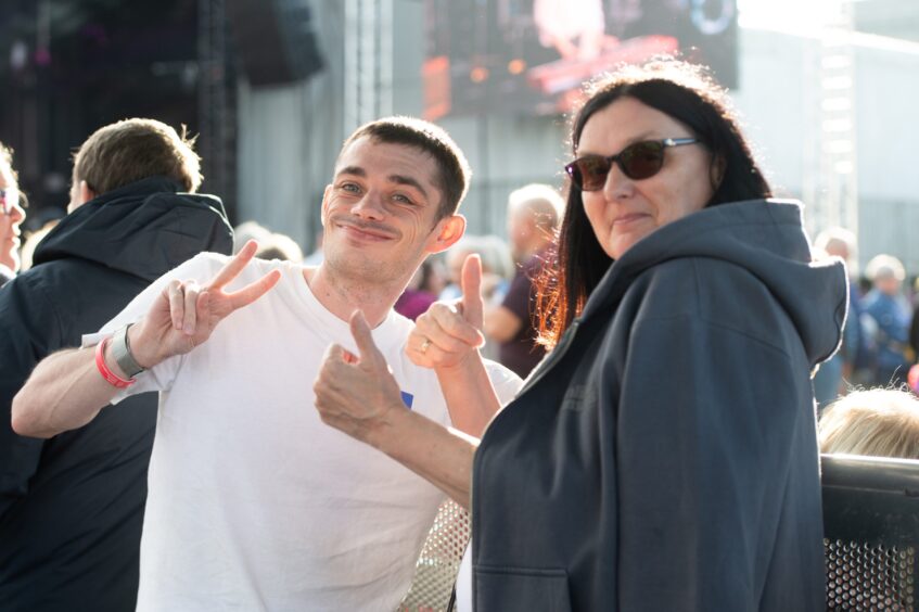 Two fans give the thumbs-up to the Discovery Festival in Dundee.