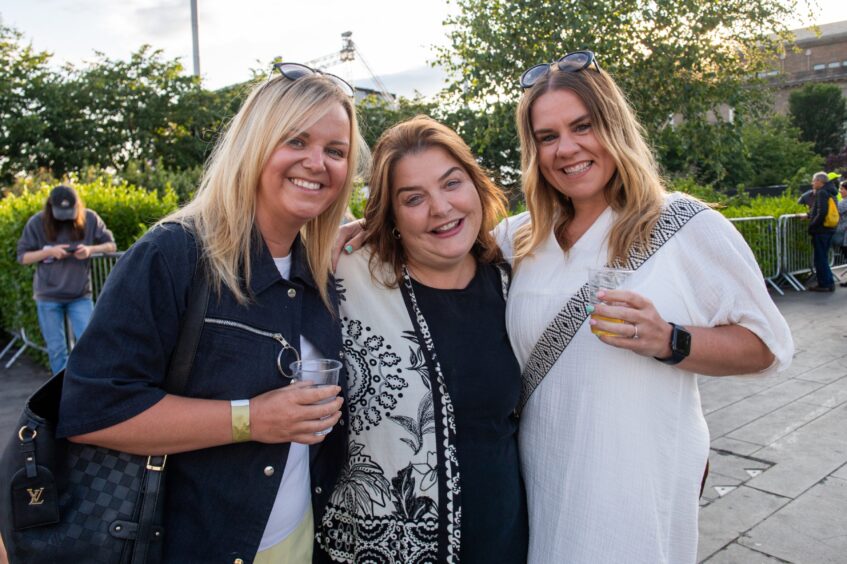 Three fans get ready to see Tom Jones in Dundee. 