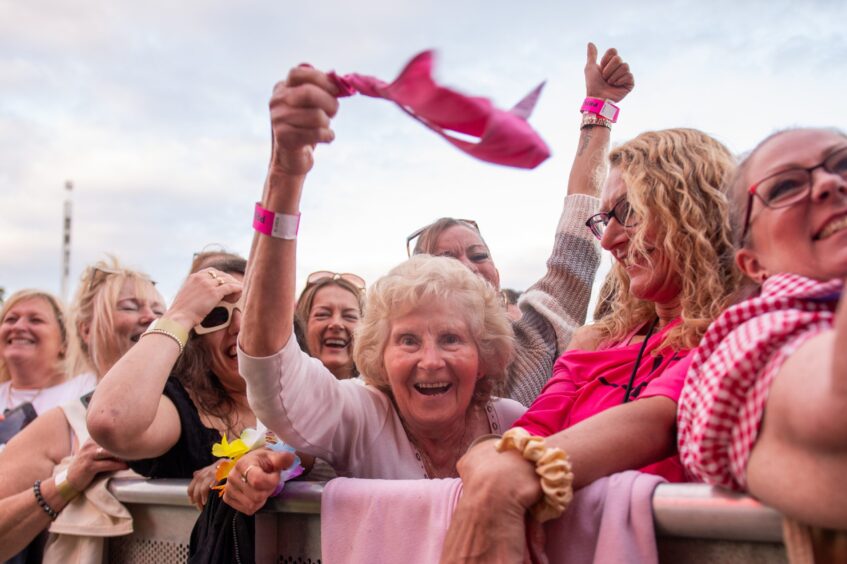 An older Tom Jones fan prepares to throw her knickers at the Welsh star during the Dundee Discovery Festival.