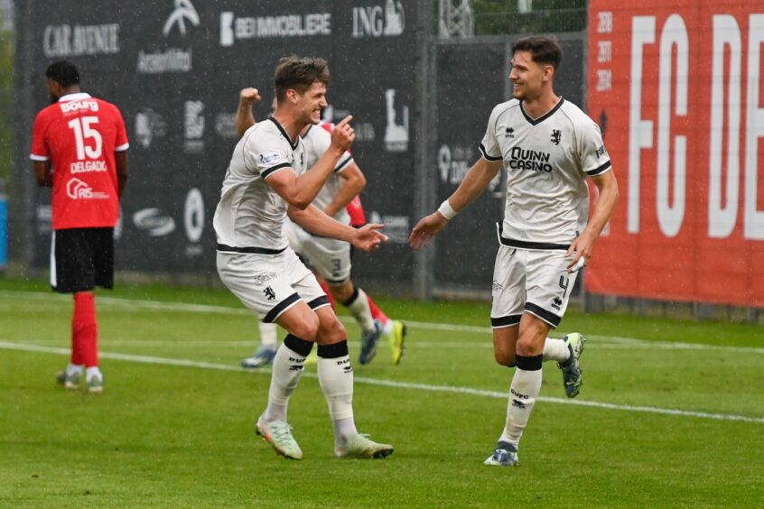 Iurie Iovu, right, celebrates his first goal in United colours