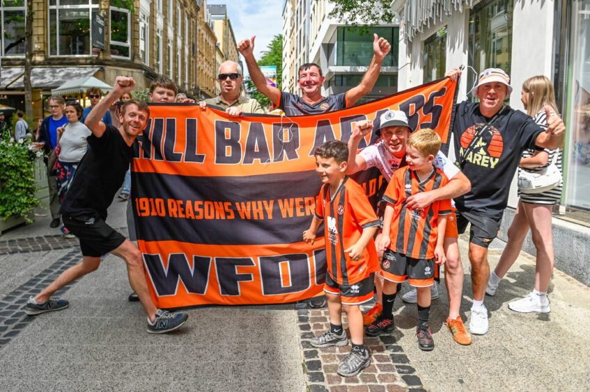 The Hill Bar Arabs show off their flag in Luxembourg City's old town.