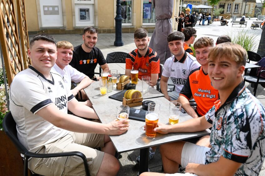 United fans having drinks in the sun in Luxembourg City.