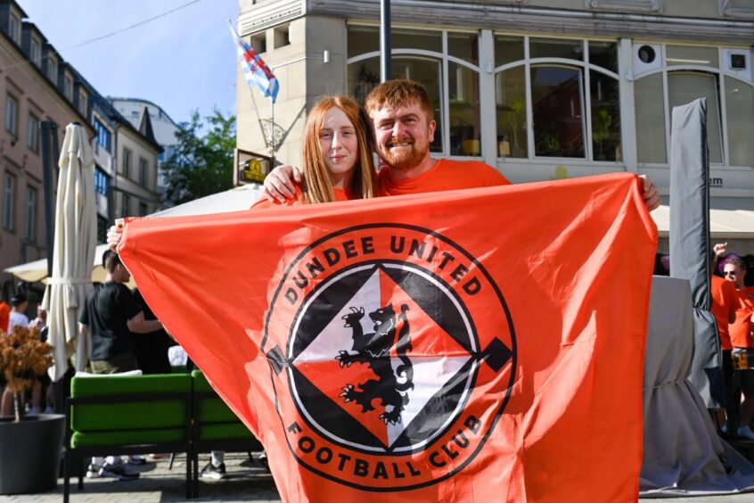 Aimee Keith with dad Gary showing off their Dundee United flag.
