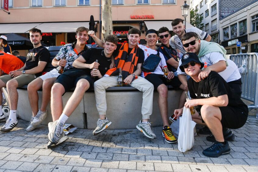 A group of Dundee United supporters soak up the atmosphere.