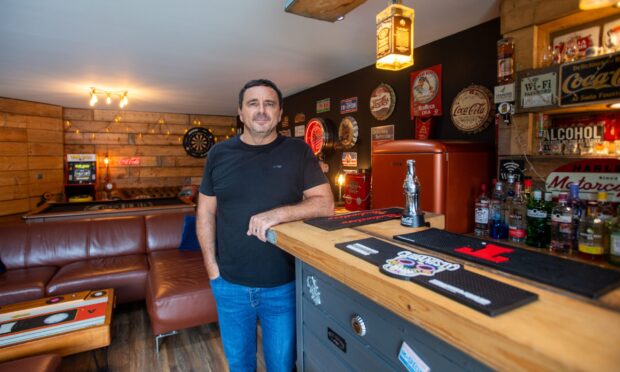Lee McKelvie with his home bar. Image: Kim Cessford/DC Thomson.