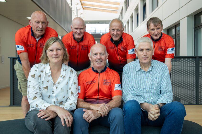 Rob, his cycling friends with some of the Parkinson's research team.
